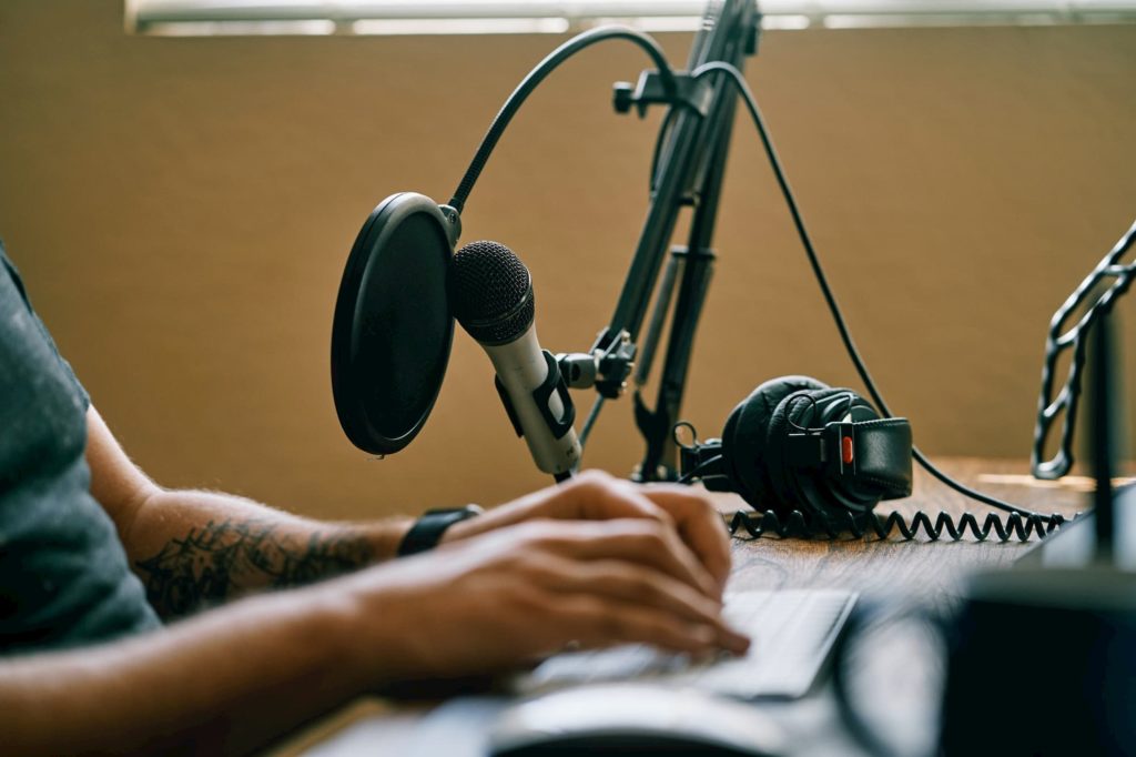 Podcast-Producer-At-Desk